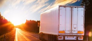 1507924634.20151229190117-road-commercial-vehicle-company-truck-car-driving-transporter-transportation-cargo-highway-business-delivery-